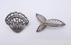 Two marcasite brooches. The largest 4 cm wide.