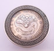 A Chinese coin box. 5 cm diameter.