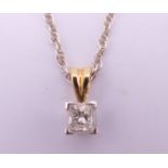 An 18 ct gold and white gold pendant on chain. 3.6 grammes total weight.