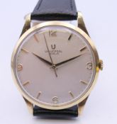 A 9 ct gold Universal Geneve gentlemen's wristwatch. 3.5 cm wide.