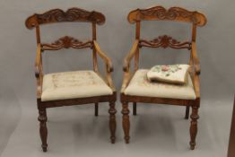 A pair of 19th century mahogany open armchairs with tapestry seats. 54 cm wide.
