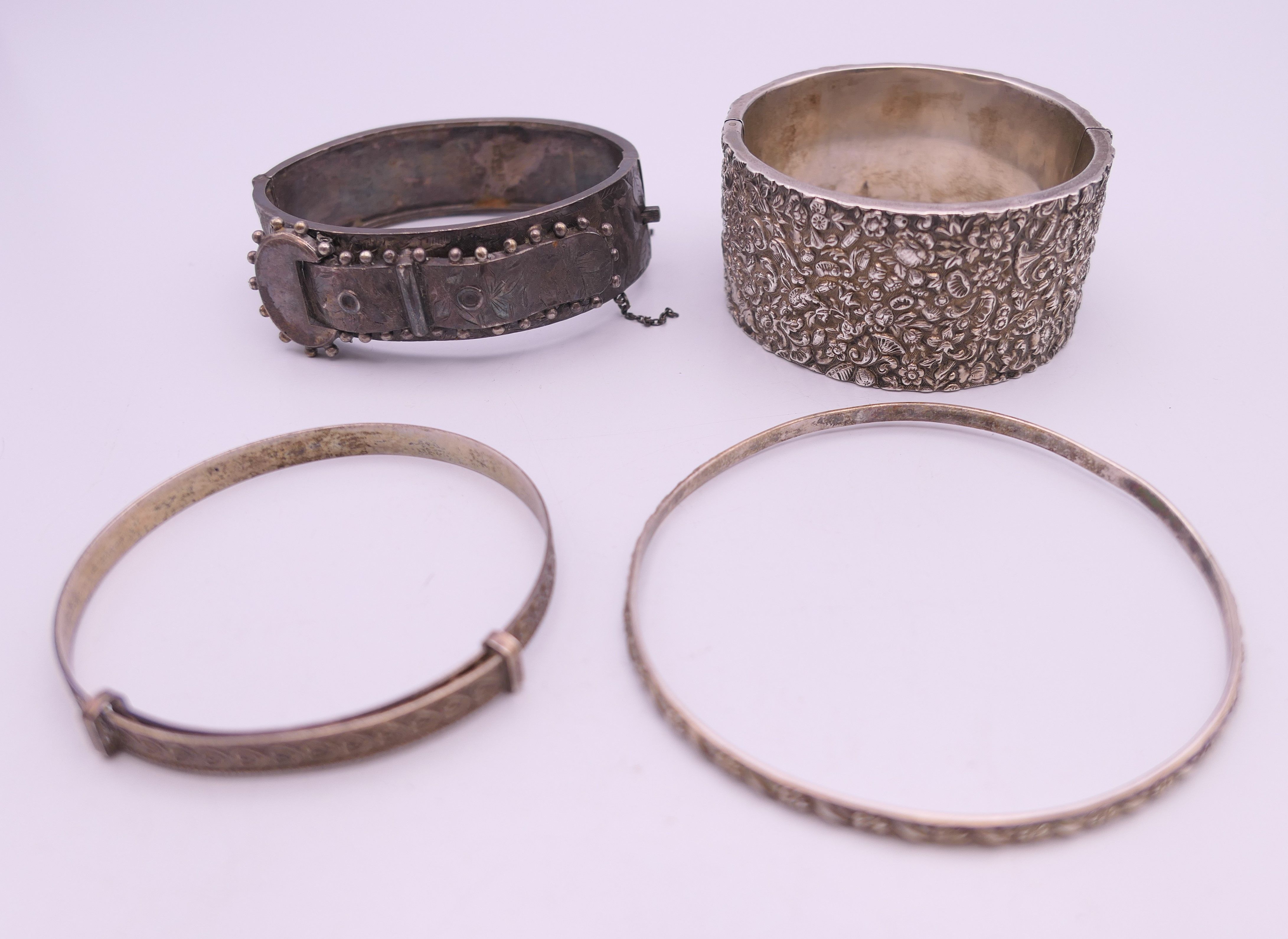 Four silver bangles. The largest 6.5 cm wide. 93.4 grammes.