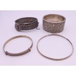 Four silver bangles. The largest 6.5 cm wide. 93.4 grammes.
