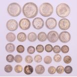 A quantity of silver and part silver coins. 128.1 grammes total weight.