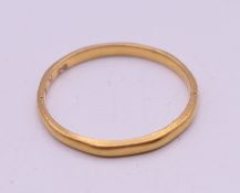 A 22 ct gold wedding band. Ring size J/K. 1.3 grammes.
