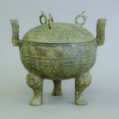 A Chinese archaic style bronze lidded vessel. 19.5 cm high.