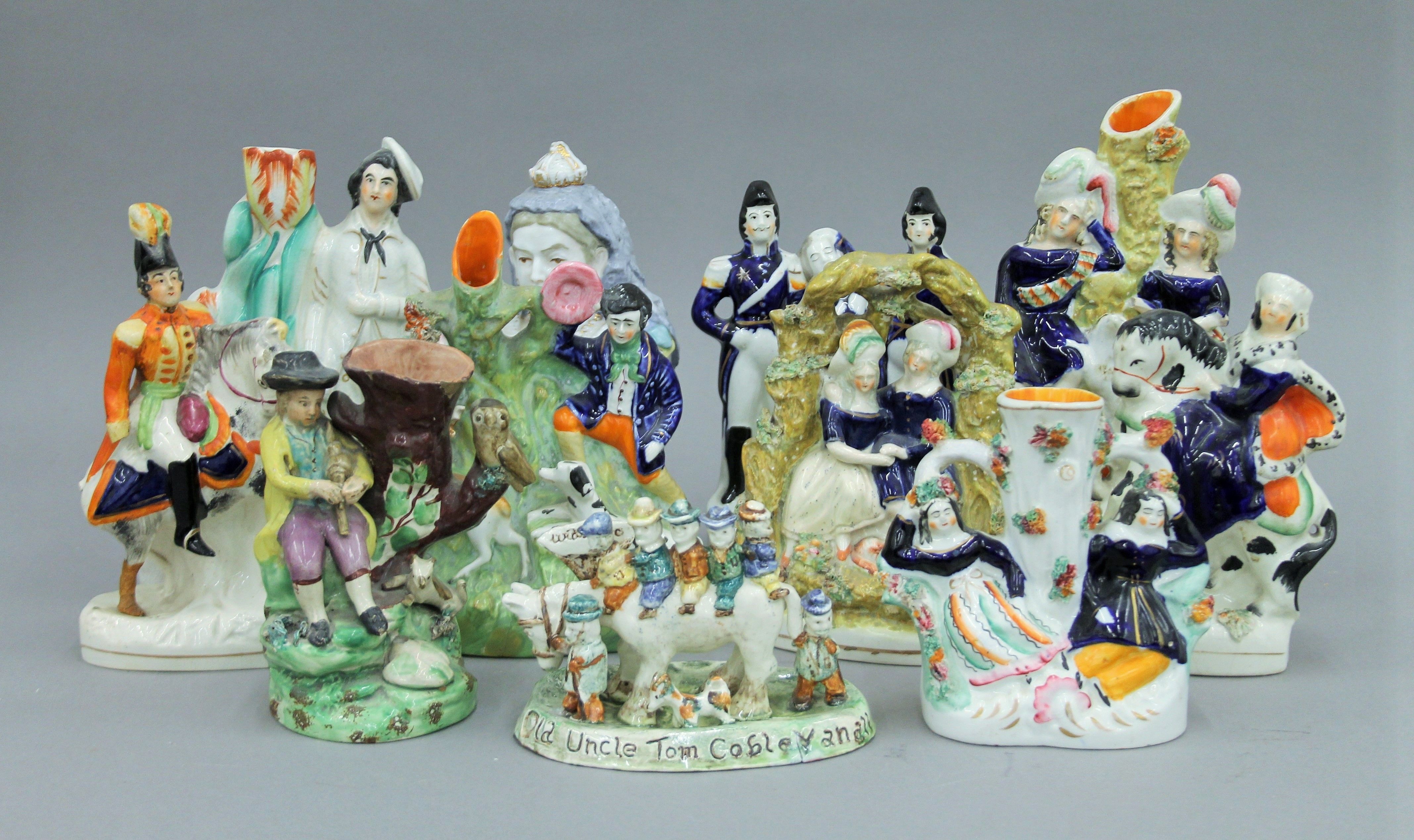 A collection of 19th century Staffordshire figures, etc. The largest 25 cm high.