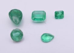 Five loose emeralds. The largest 8 mm long.