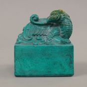 A Chinese turquoise coloured seal. 11 cm high.