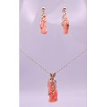 A coral pendant and matching earrings, set in 9 ct gold with a 9 ct gold chain. Pendant 4.