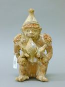 A South American painted pottery figure. 22.5 cm high.