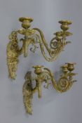 A pair of bronze wall sconces. 33 cm high.
