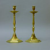 A pair of brass candlesticks. 35 cm high.