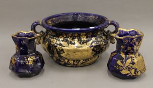 A gilt decorated Masons Ironstone jug, another jug and a large twin handled jardiniere.