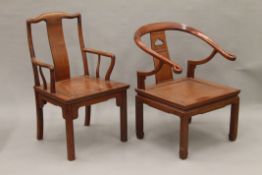 Two Chinese hardwood open armchairs. The largest 61 cm wide.
