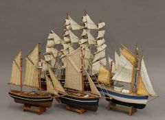 Four model sailing boats. The largest 55 cm long.
