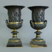 A pair of bronze urns. 37 cm high.