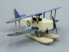 A tin plate model of a sea plane. 28 cm wide.