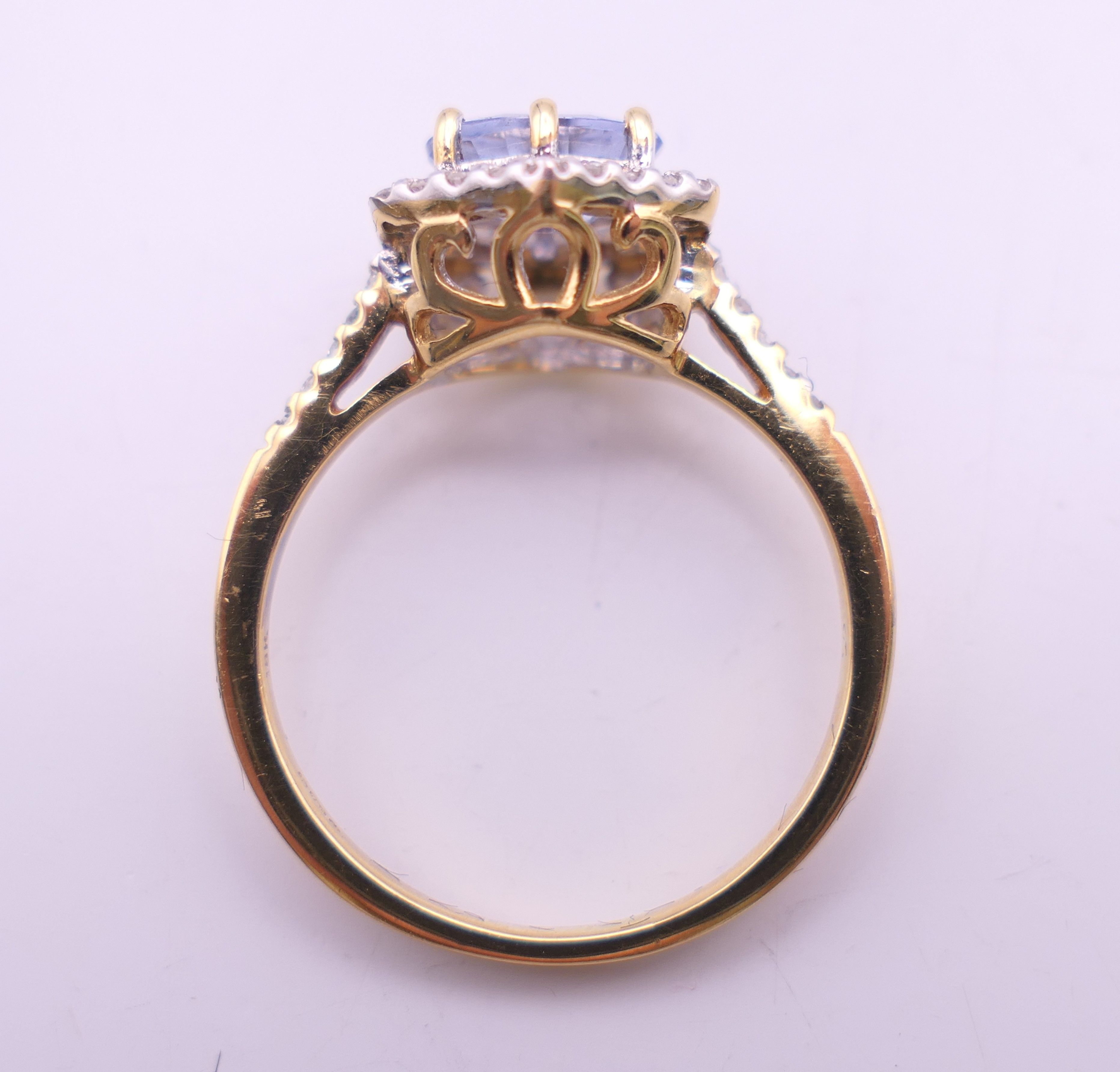 An 18 ct gold Ceylon sapphire and diamond ring. 10 mm x 10 mm. Ring size L/M. 3. - Image 8 of 9