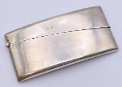 A George V silver rectangle curved card case, Birmingham 1923. 4 cm wide. 36.3 grammes total weight.