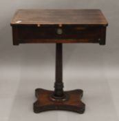 A 19th century rosewood pedestal single drawer side table. 69 cm wide.