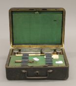 A Victorian leather travelling vanity box. 22.5 cm long.