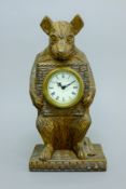 A wooden clock formed as a bear. 30 cm high.