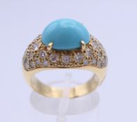 An 18 ct gold turquoise and diamond ring. Ring size N. 8.6 grammes total weight.