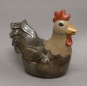 A large pottery model of a cockerel. 34 cm high.