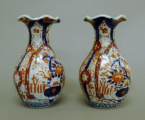 A pair of Imari vases. 21 cm high.