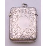 A Victorian silver vesta with leaf chased pattern, Chester 1899. 4 cm wide. 4 grammes total weight.