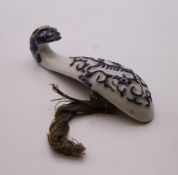 A Chinese blue and white porcelain belt hook. 10 cm high.