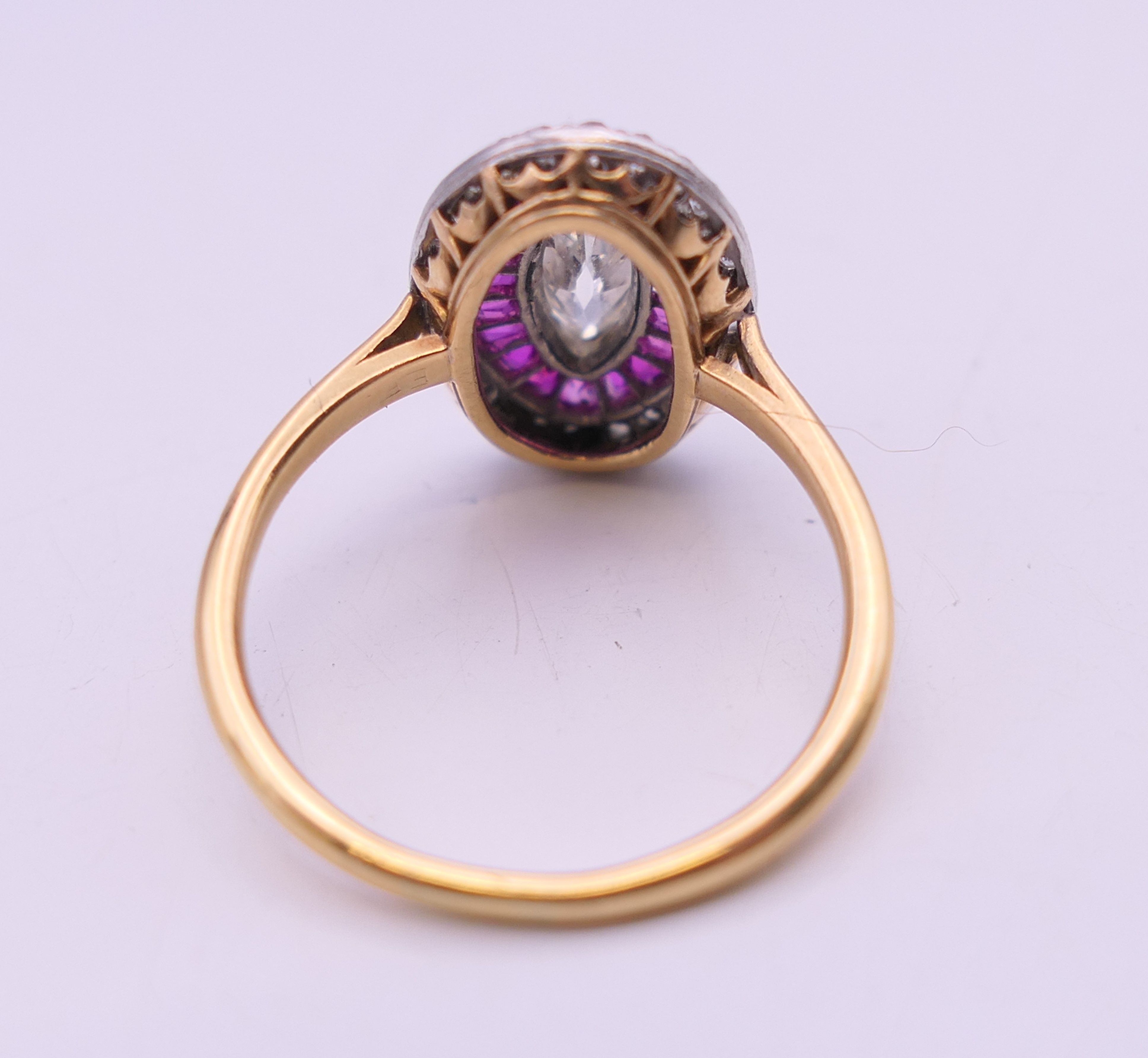 An unmarked 18 ct gold diamond and ruby ring, the central stone 9 mm high. Ring size O. 4. - Image 6 of 6