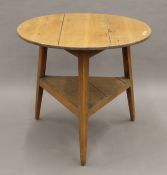 A 19th century pine cricket table. 79 cm diameter.