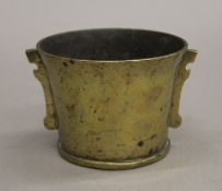 A Chinese bronze censer, the underside with seal mark. 8 cm high.