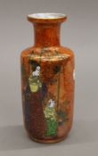 A Wilton Ware lustre vase decorated with Japanese figures. 20 cm high.