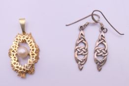 A rolled gold and seed pearl pendant, and a pair of silver earrings. The pendant 3 cm high.