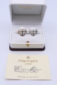 A pair of Patek Phillipe cufflinks, stamped 925 Geneva, in a Hackett of London box,