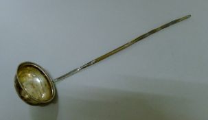 A Georgian silver baleen handled toddy ladle. 35 cm long.