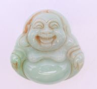 A jade Buddha pendant. 5 cm high.