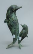 A bronze model of two dolphins. 28 cm high.