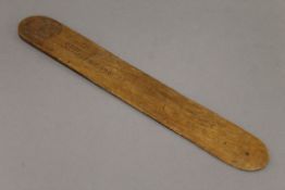 A carved wooden page turner, inscribed ''P.O.W St Helena 1901''. 37 cm long.