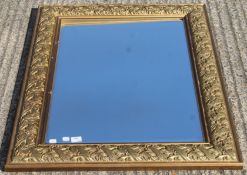 A large modern gilt framed mirror. 114 x 83.5 cm.