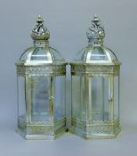 A pair of silvered lanterns. 65 cm high.
