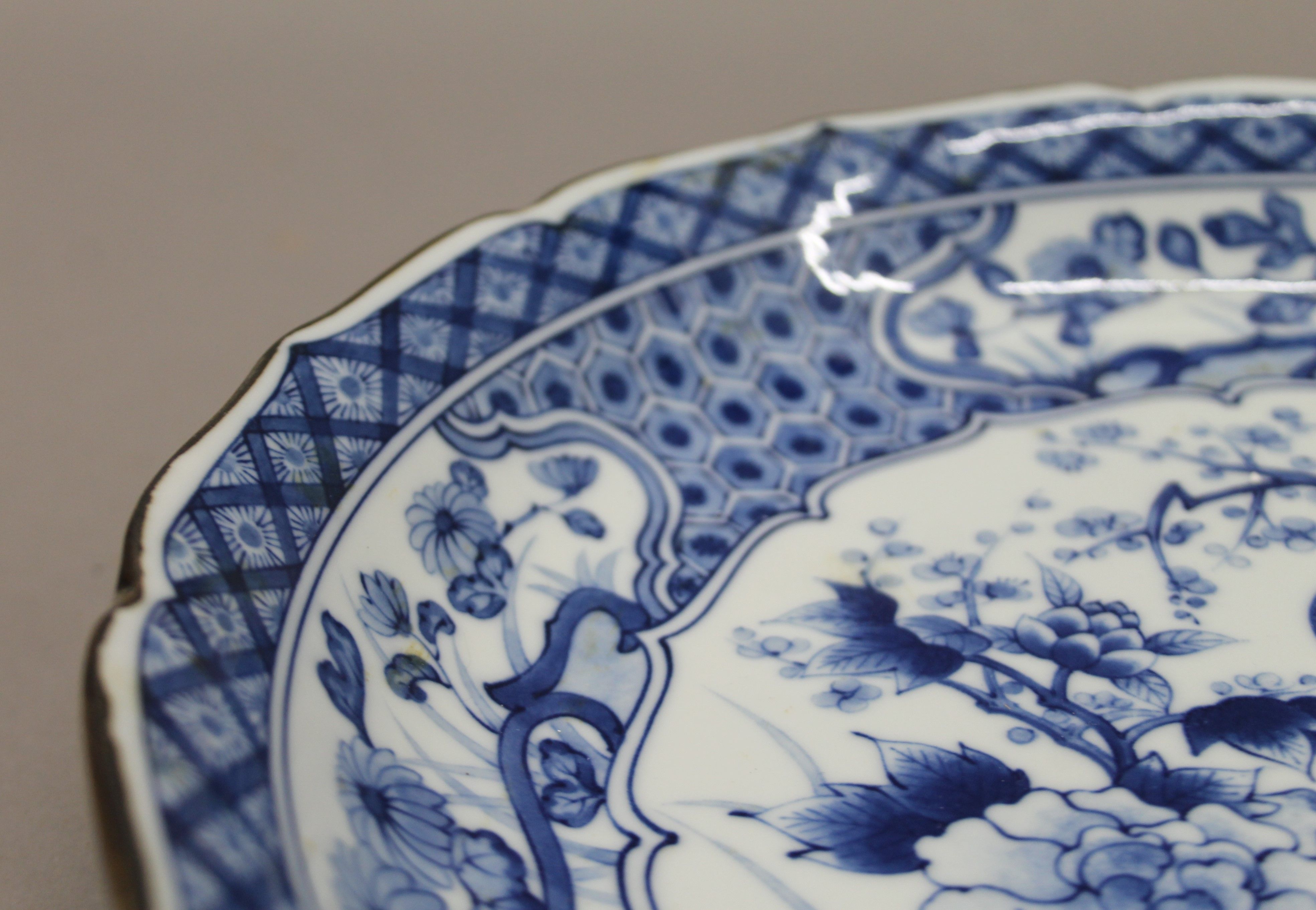 A large Japanese blue and white porcelain dish decorated with peacock perched on blossoming prunus - Image 3 of 4