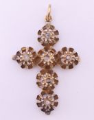 A 19th century old rough cut diamond set gilt cross form pendant. 3.75 cm high.