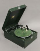 A green HMV gramophone, in working order. 38 cm long.