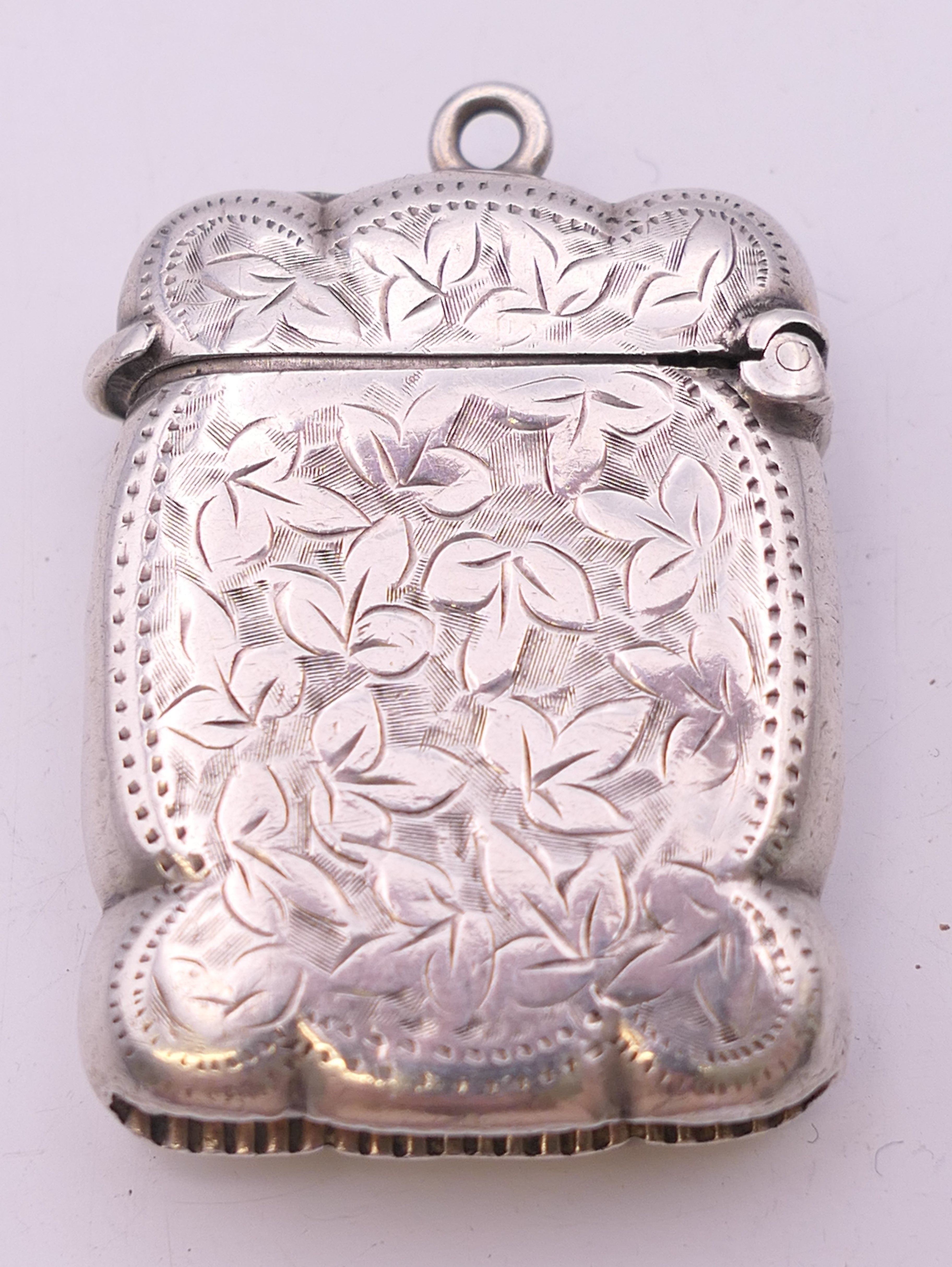 A Victorian silver vesta converted to a lighter, with leaf chased pattern, Birmingham 1875. - Image 2 of 6