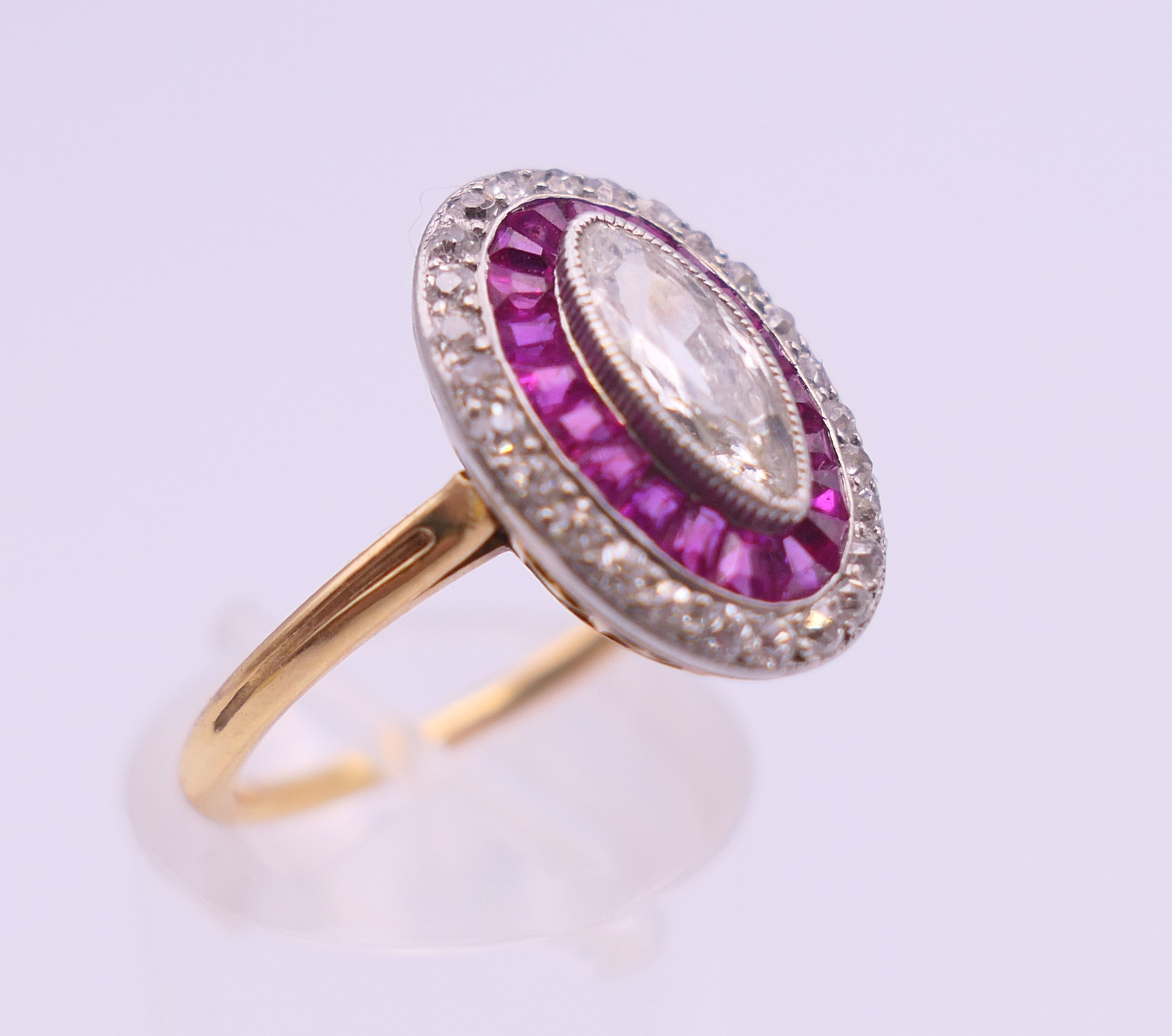 An unmarked 18 ct gold diamond and ruby ring, the central stone 9 mm high. Ring size O. 4. - Image 3 of 6