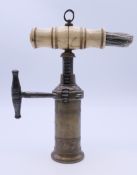 A 19th century bone handled patent cork screw. 14 cm high when closed.